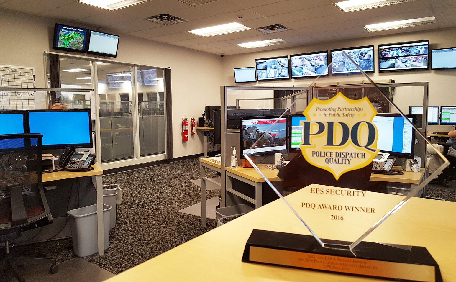 pdq award for monitoring on display at eps security on a desk