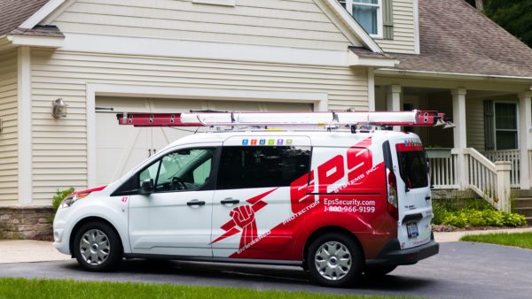 EPS van parked in a house's driveway