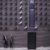 dozens of box cameras pointed downward at two women from the side of a commercial building