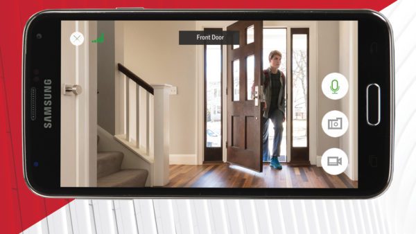 samsung phone displaying teenage boy entering door using total connect camera app