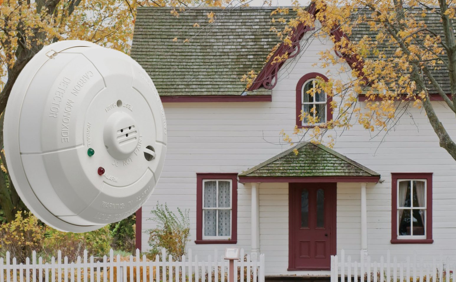 house in the autumn with a superimposed CO detector