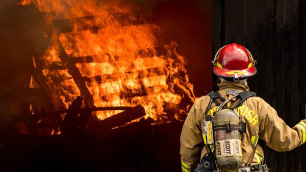 firefighter looking at active fire