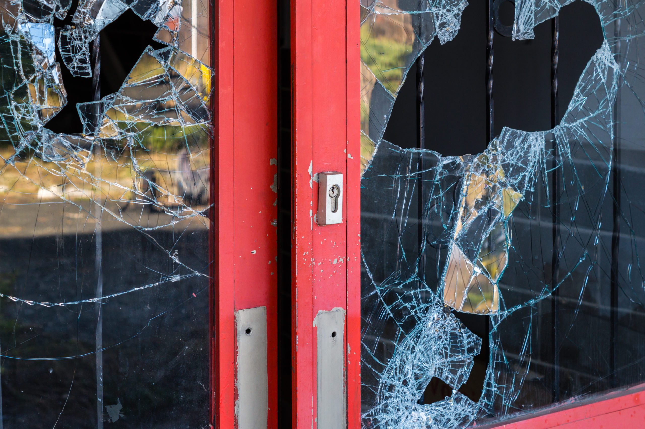 door glass broken by vandal or burglar