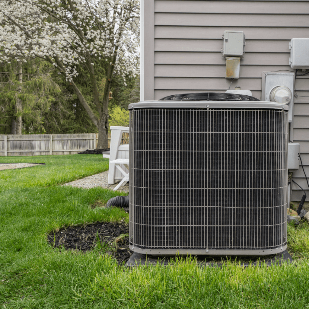 Air conditioning unit outside of home during spring