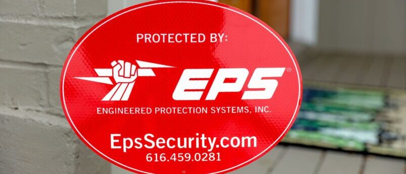 Closeup of EPS Security yard sign in front of home
