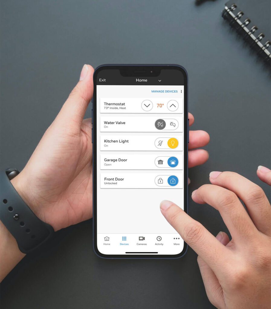 Person holding phone, screen shows light control, ac control, and other locks